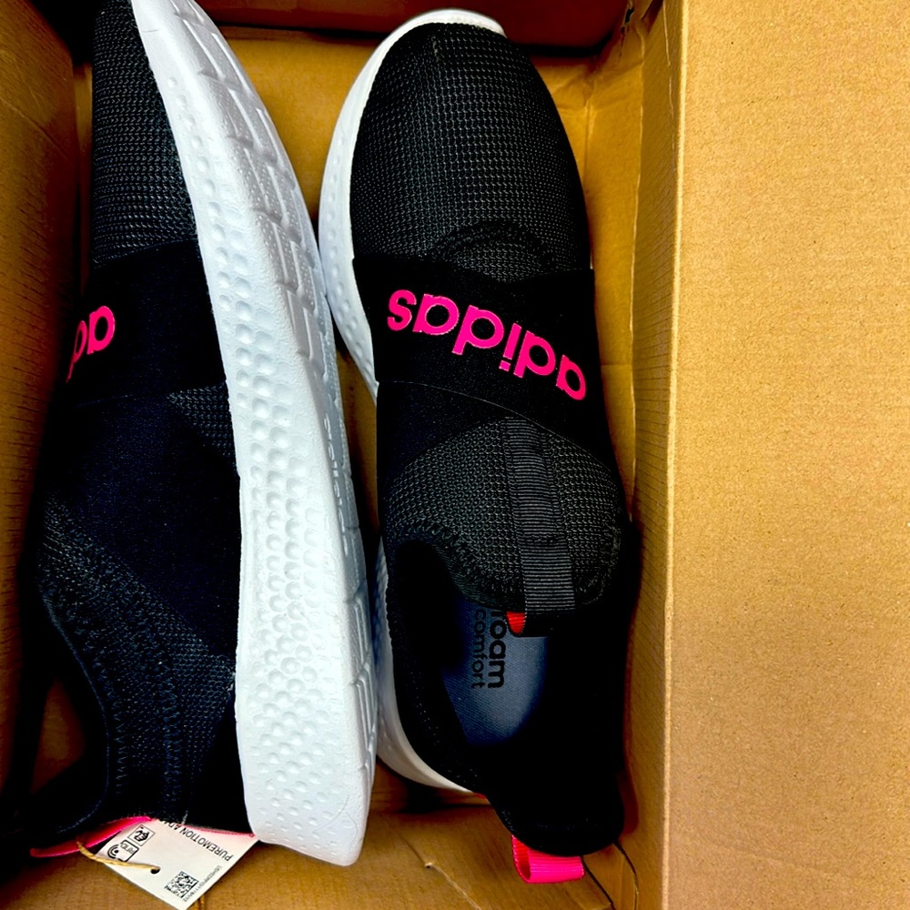 Black and pink adidas slip ons